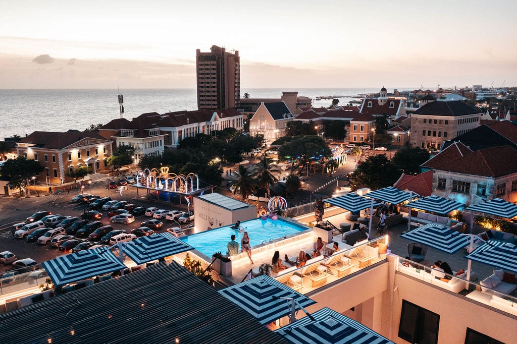 Cascada Rooftop Bar aerial view at sunset — infinity pool, Willemstad Curaçao